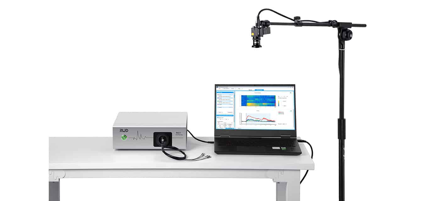 R821 Tricolor Multichannel Fiber Photometry System connected to a laptop on a table